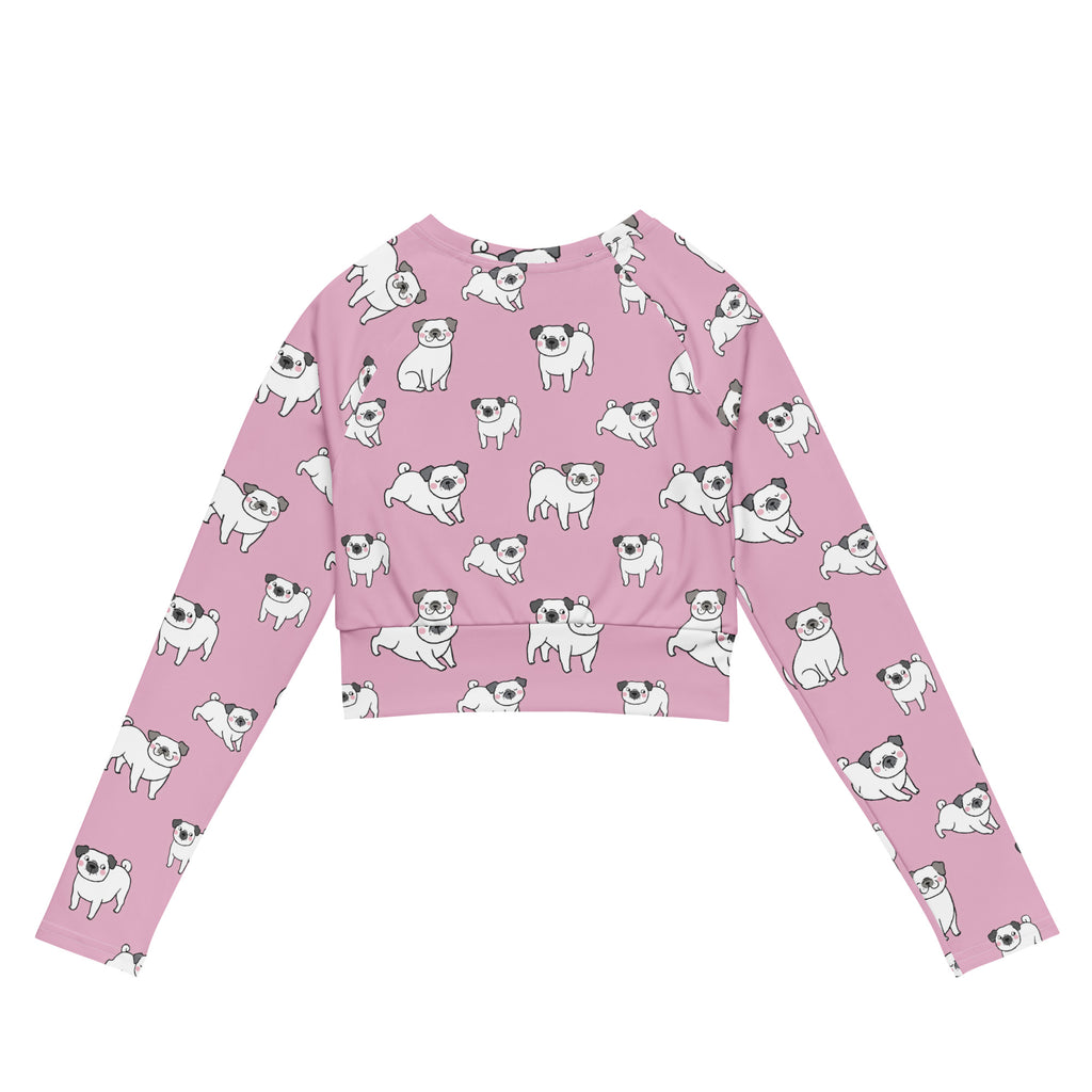 Women’s pink pug long sleeve performance crop top with playful all-over black and white cartoon pug print
