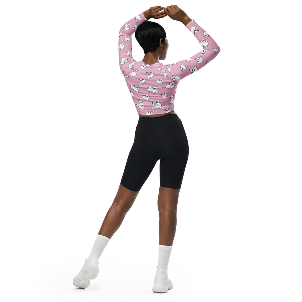 Women’s pink long sleeve performance crop top with white pug dog pattern designed for active wear