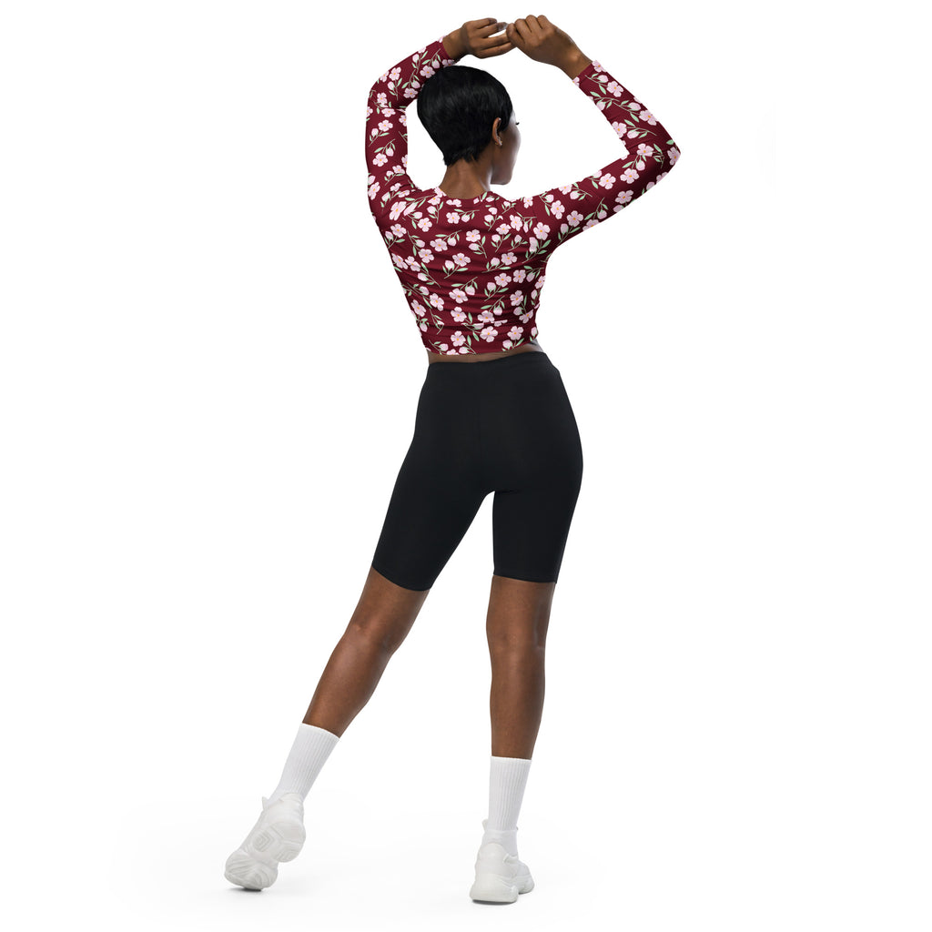 Women’s burgundy floral long sleeve performance crop top with white pattern designed for active wear