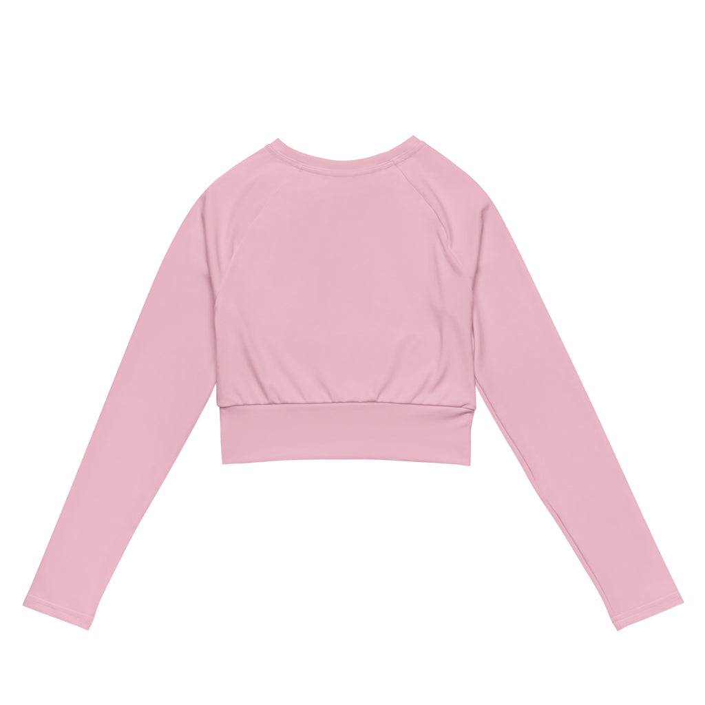 Women’s light pink long sleeve performance crop top with rounded neckline and elasticized waistband