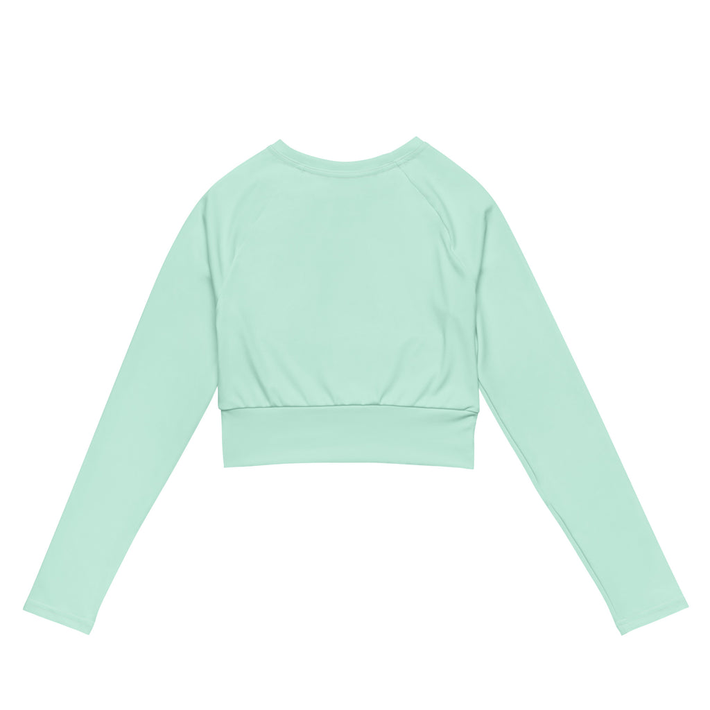 Women’s mint green long sleeve performance crop top with ribbed waistband and round neckline in soft breathable fabric