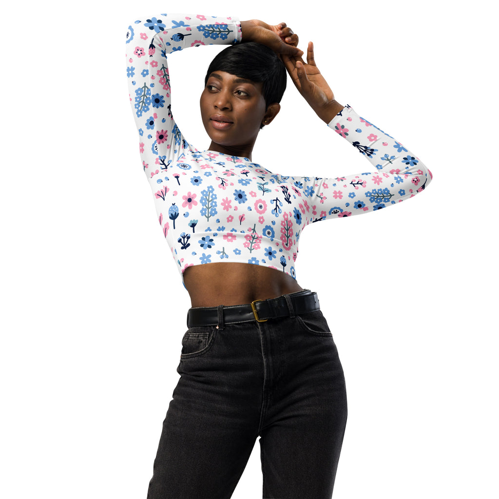 Women’s pastel floral print long sleeve white crop top with pink and blue flowers and stretchy fabric for performance