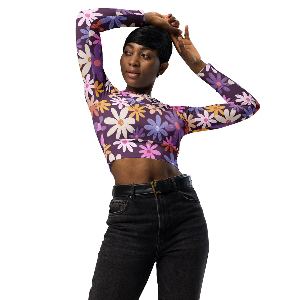 Women’s purple floral long sleeve performance crop top with colorful daisy pattern for active wear