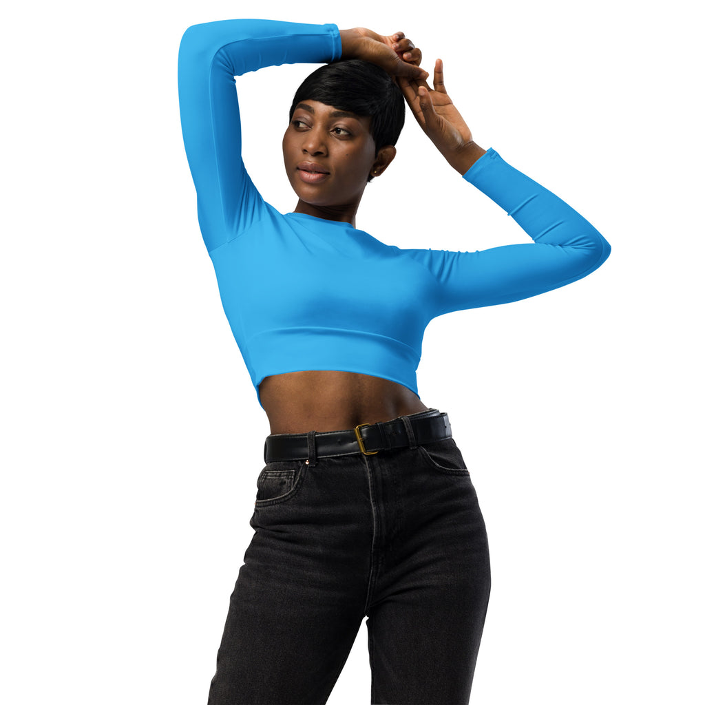Women’s sky blue long sleeve performance crop top with fitted stretchy fabric designed for active wear