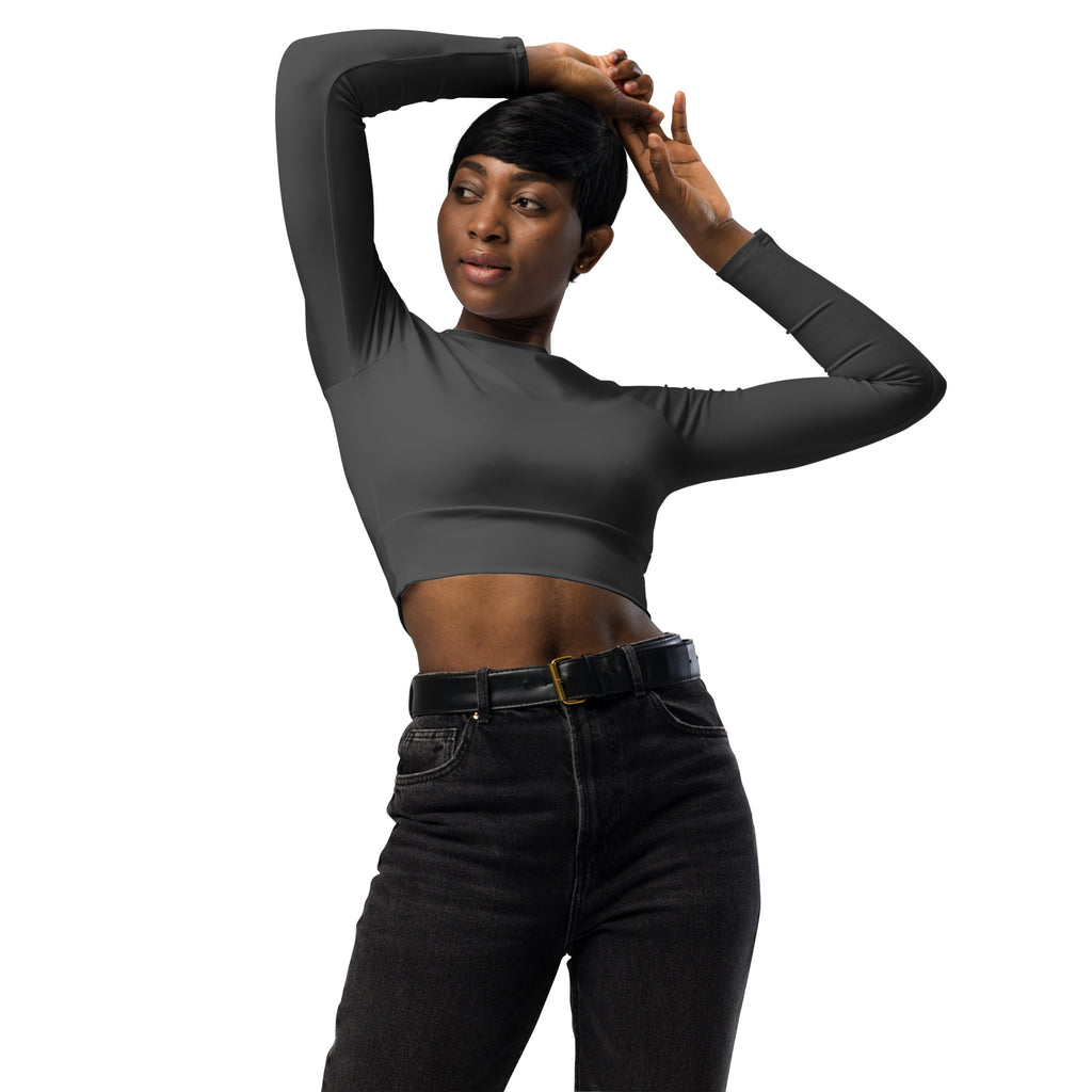 Women’s charcoal long sleeve performance crop top with high neckline and form-fitting sleek dark gray design
