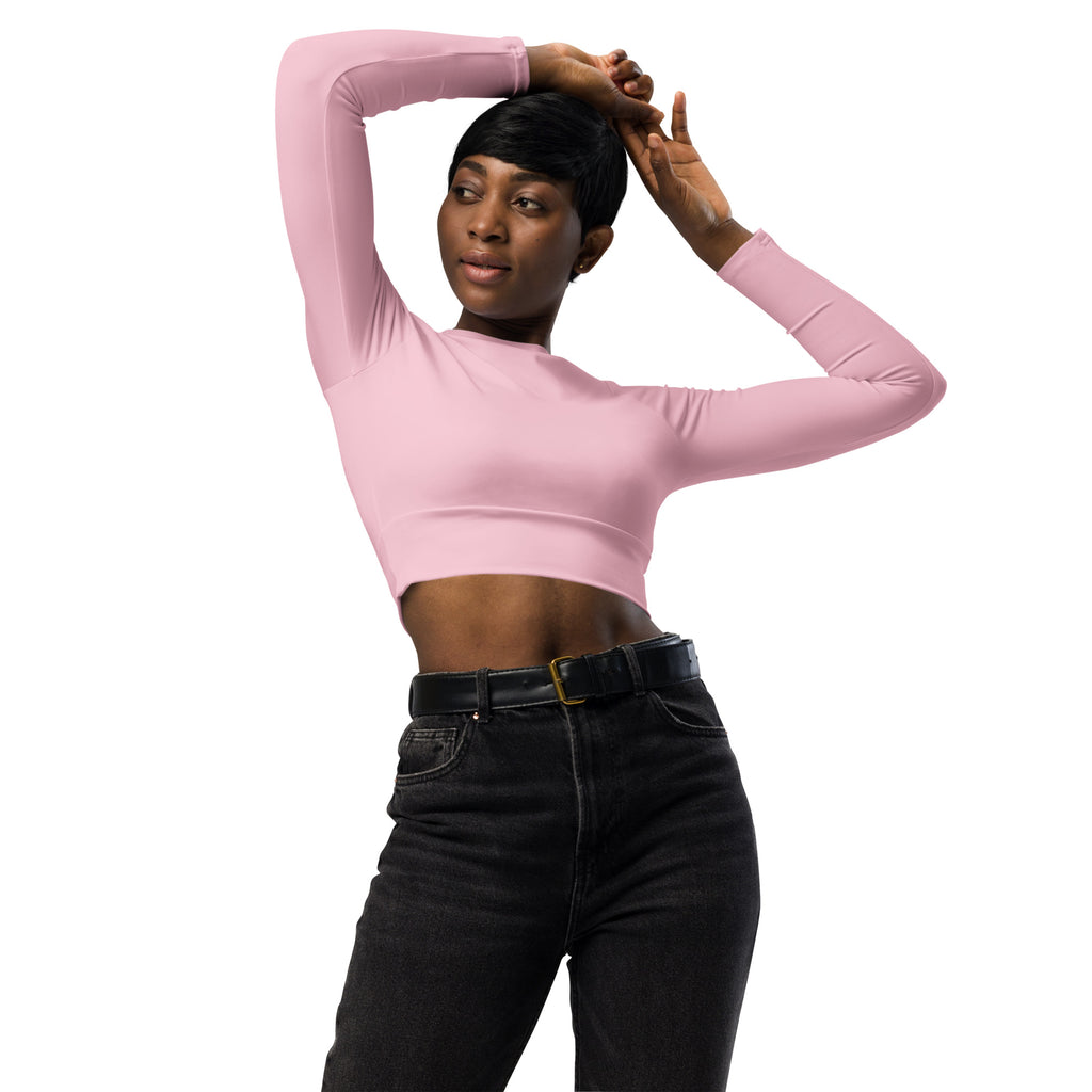 Women’s light pink long sleeve performance crop top with fitted stretchy soft fabric for active wear