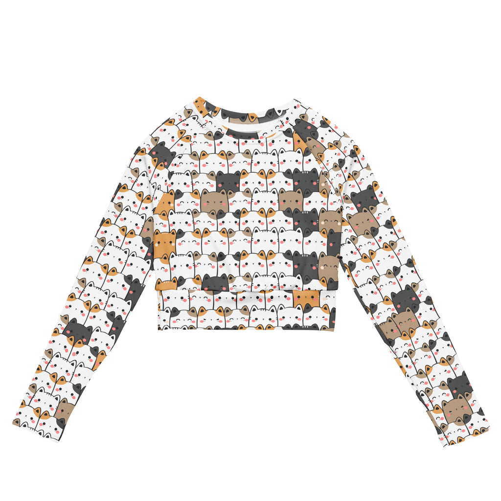 White long-sleeved crop top with colorful kawaii cartoon cat faces designed for women’s performance wear