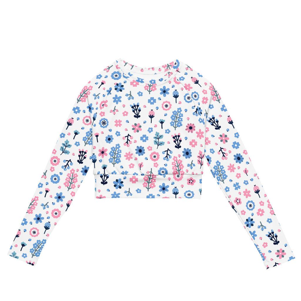 Women’s pastel floral print long sleeve white crop top with pink and blue flowers and green stems for performance wear