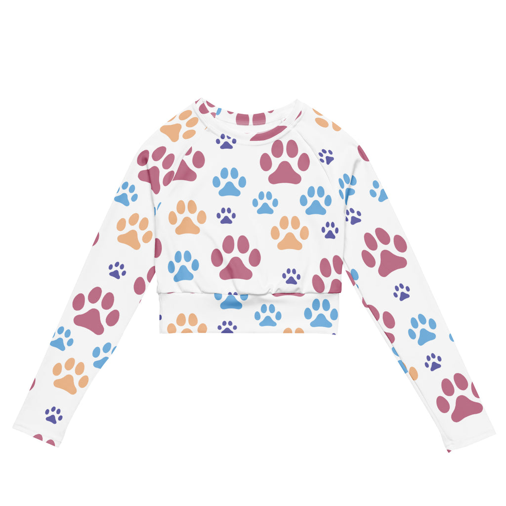 White long sleeve performance crop top with colorful pink blue and orange paw print pattern for women