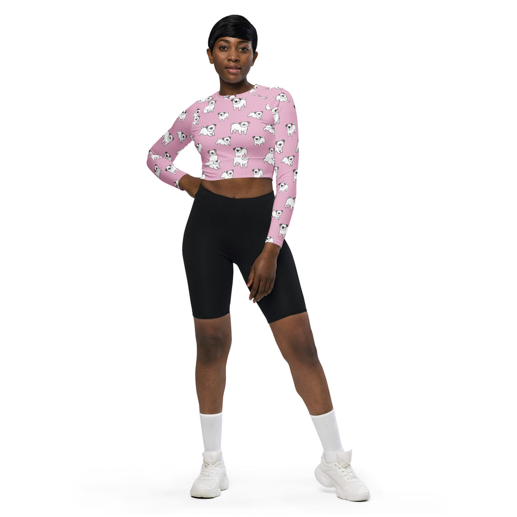 Women’s pink long sleeve performance crop top with white cartoon pug pattern designed for active wear