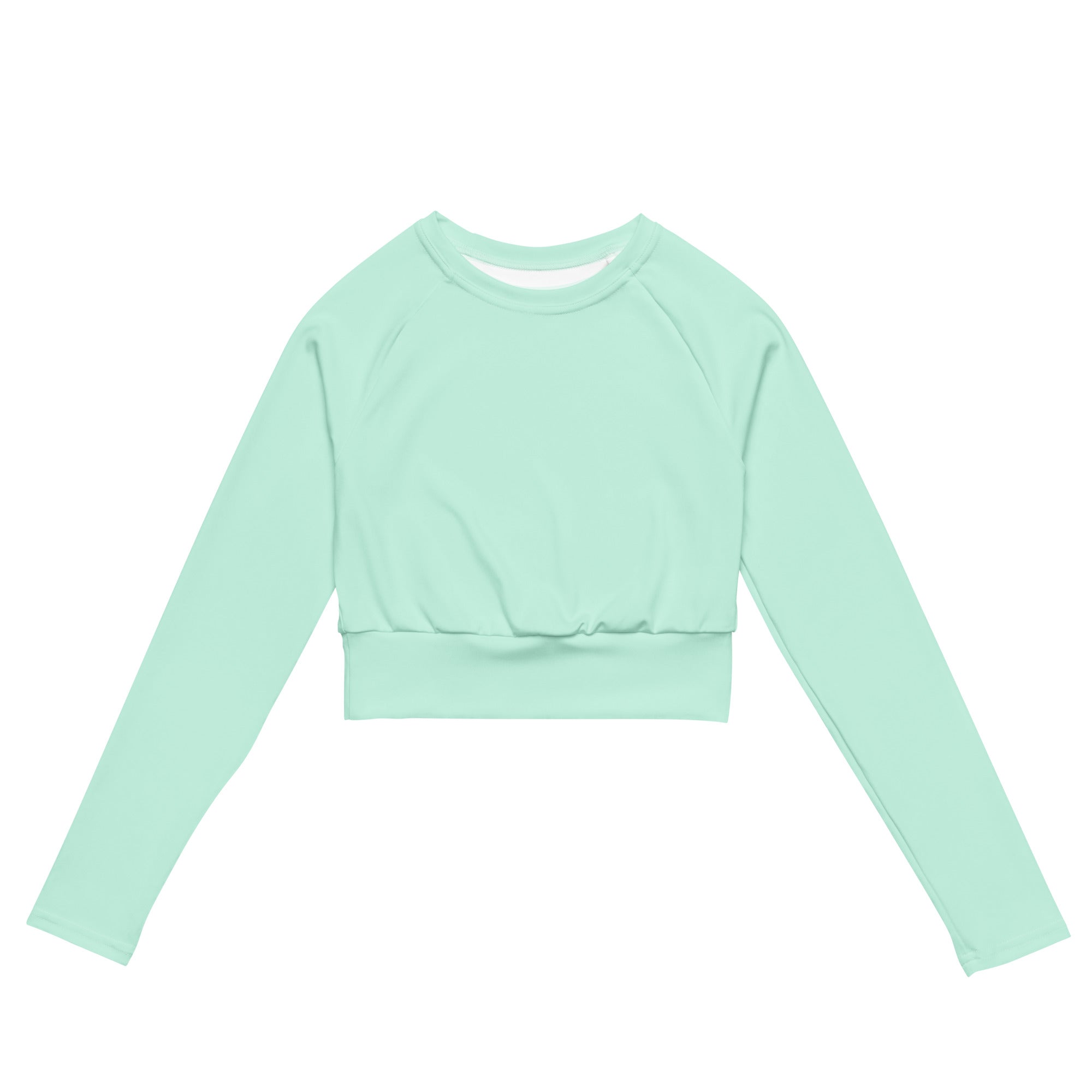 Women’s mint green long sleeve performance crop top with ribbed waistband and crew neckline made from breathable fabric