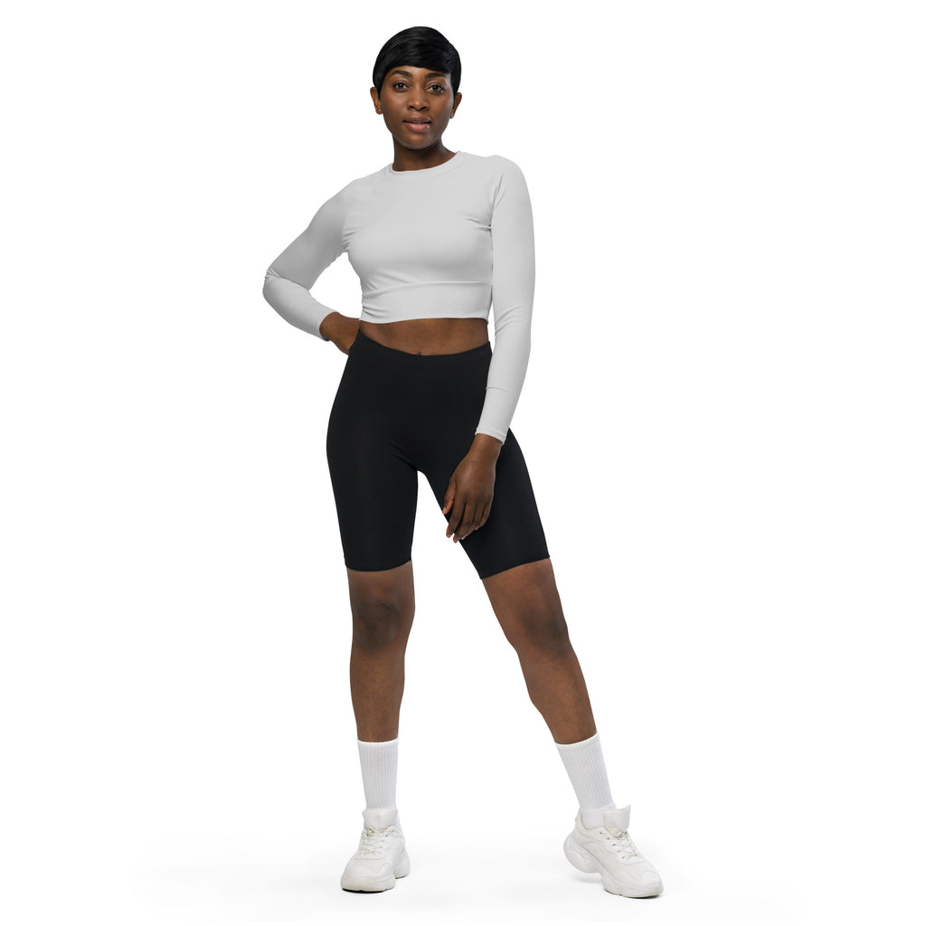 Women’s light gray long sleeve performance crop top with round neckline fitted silhouette in white fabric
