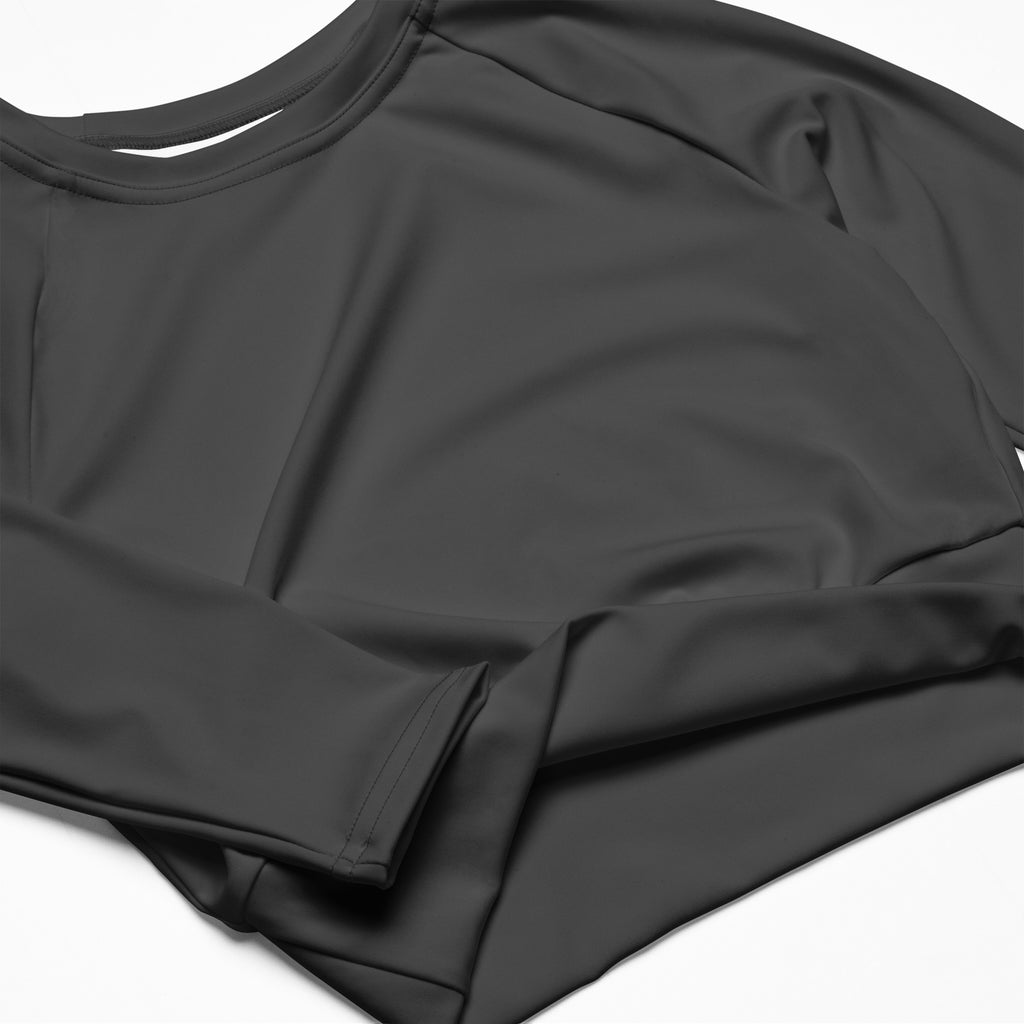 Women’s charcoal long sleeve performance crop top with round neckline and smooth stretchy fabric front view