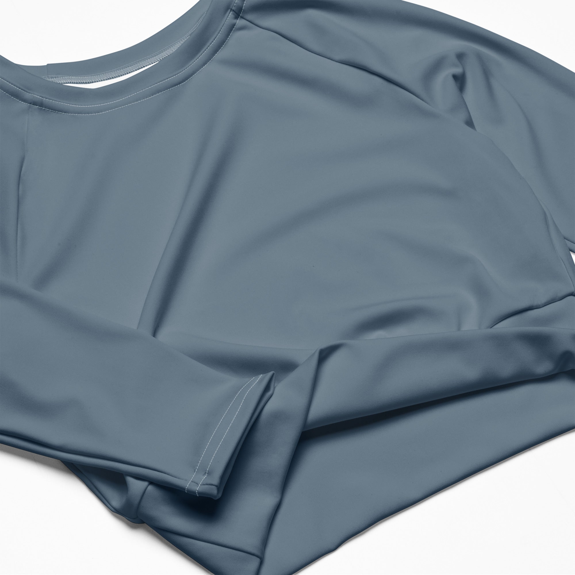 Women’s slate blue long sleeve performance crop top with smooth stretchy fabric and subtle seam detailing
