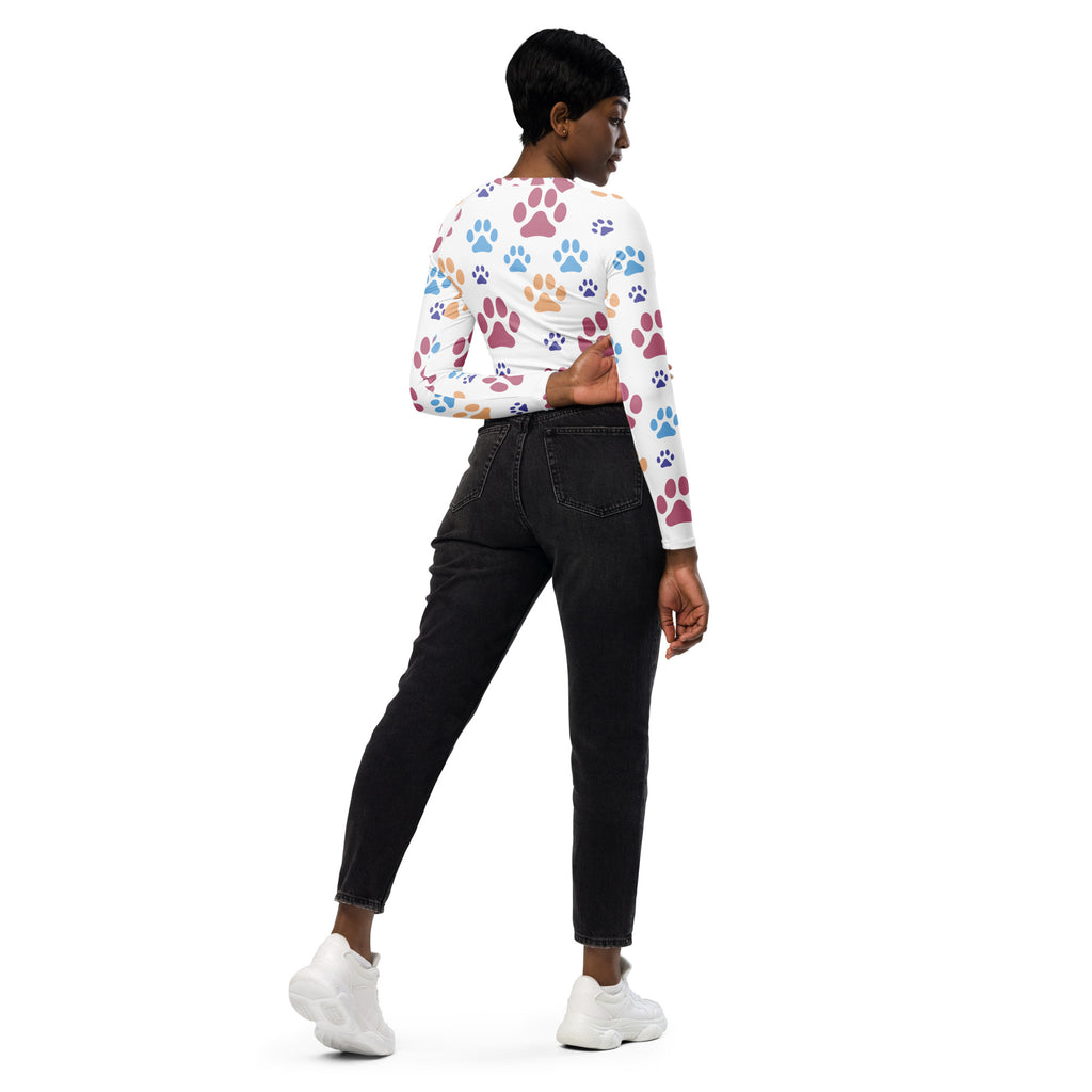 Women’s white long sleeve crop top with colorful pink blue and brown paw print pattern performance fabric