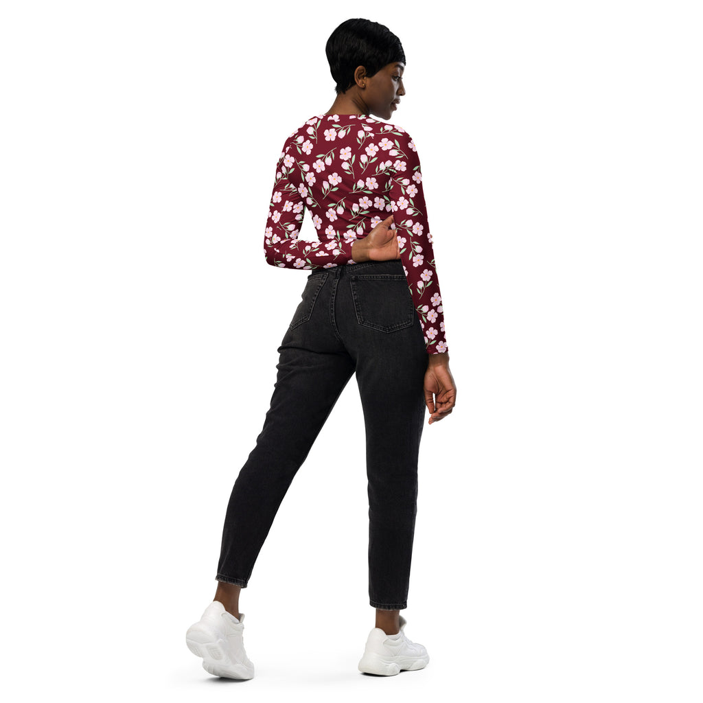 Women’s burgundy floral long sleeve performance crop top with fitted silhouette and delicate white pattern