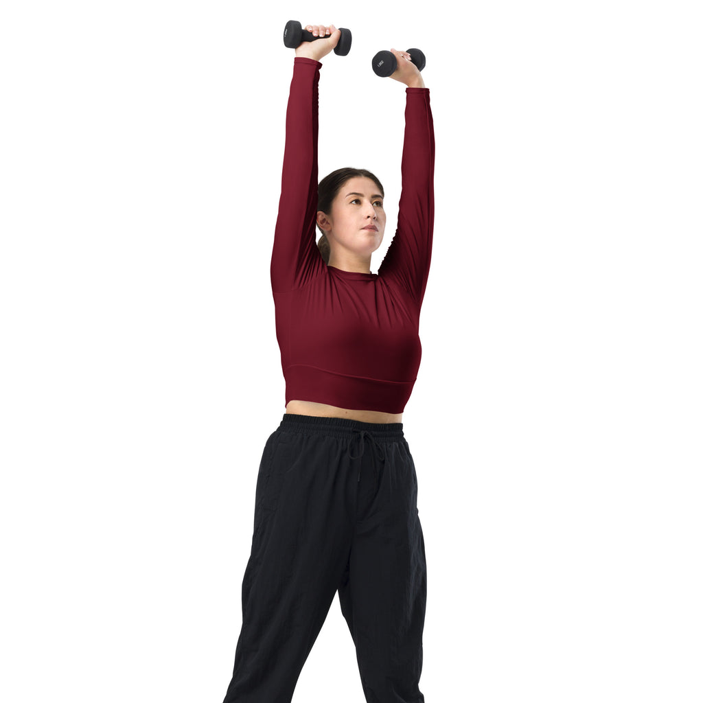 Women’s maroon long sleeve performance crop top with fitted ribbed texture for active wear