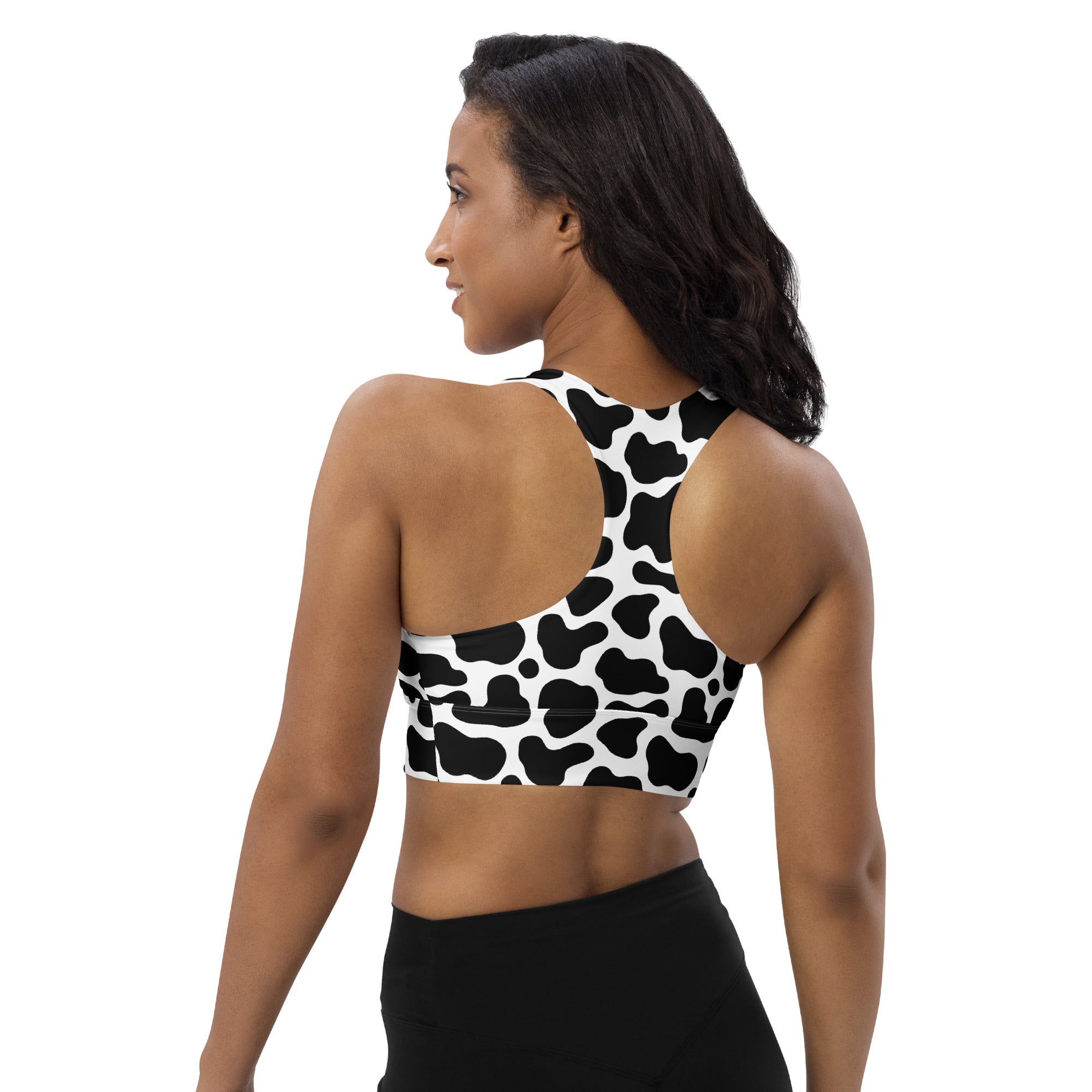 Women’s black and white cow print buttery soft recycled longline sports bra with high intensity support