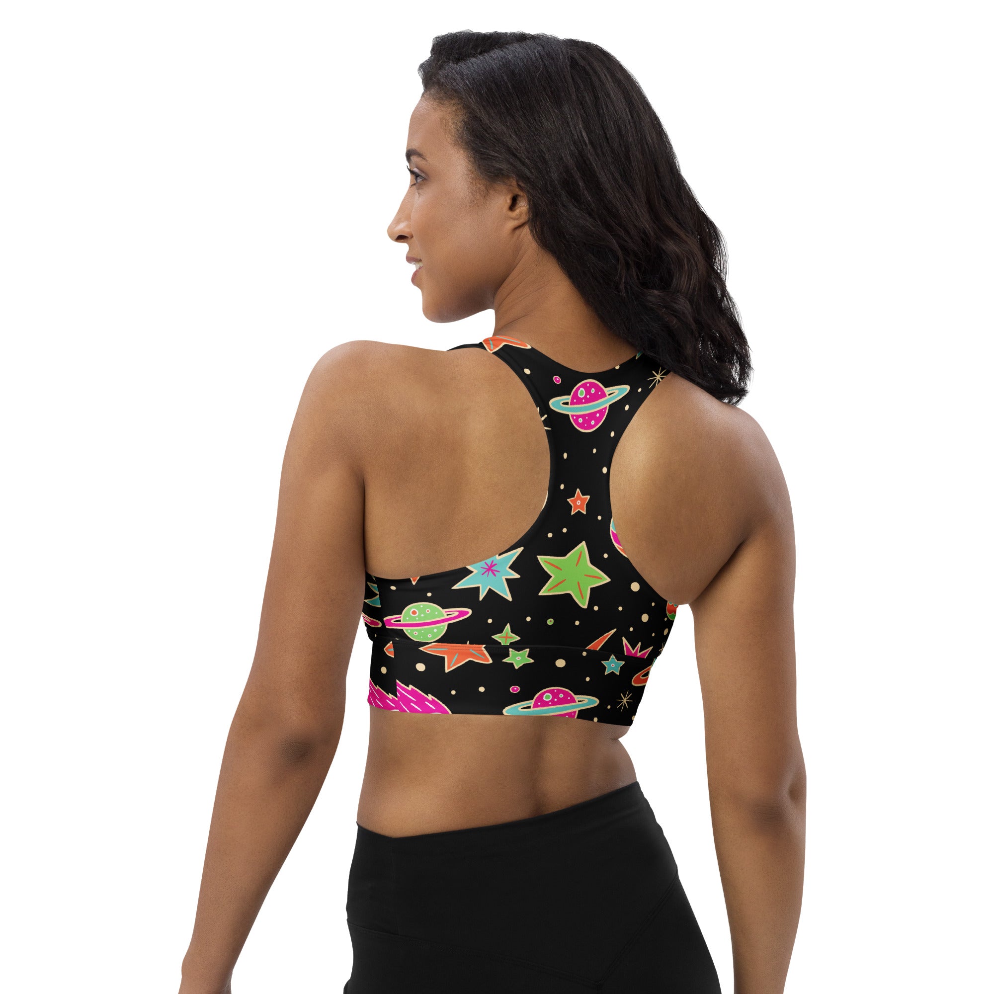 Women’s black space-themed sports bra with vibrant neon planets stars and rockets buttery soft recycled fabric
