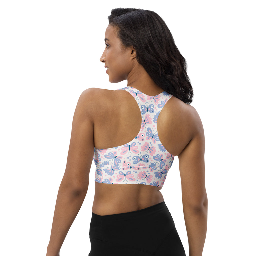 Women’s butterfly print buttery soft recycled longline sports bra with pink and blue butterflies on white background