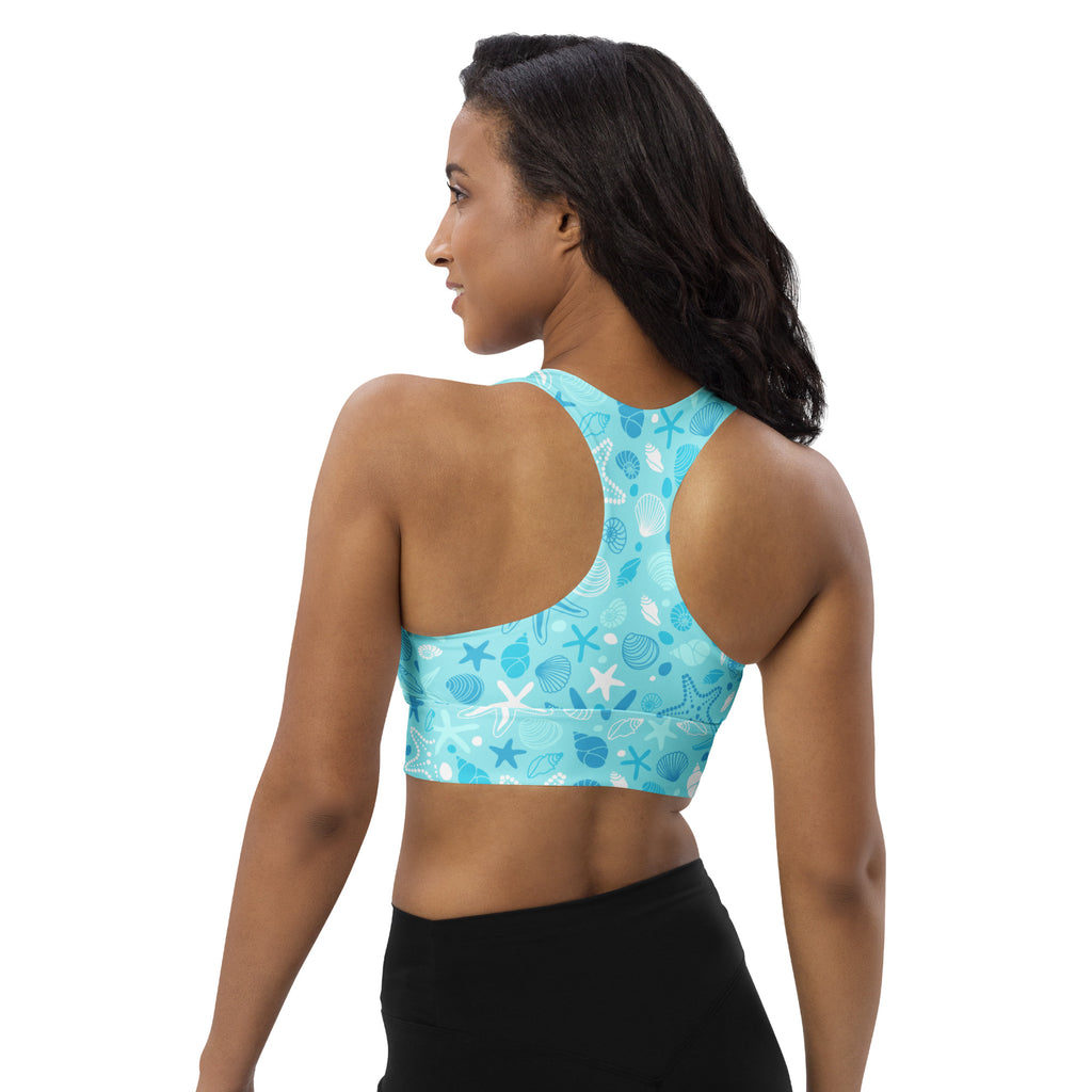 Women’s turquoise longline sports bra with white and dark blue sea creature pattern high intensity support quick dry upf 50+