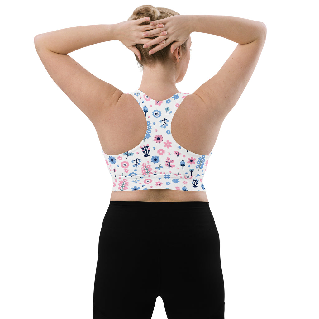 Women’s white longline sports bra with pink and blue floral pattern buttery soft recycled fabric high support