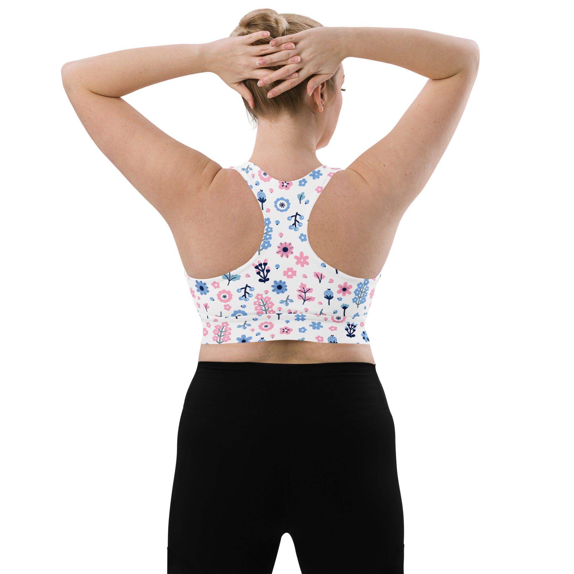 Women’s white longline sports bra with pink and blue floral pattern buttery soft recycled fabric high support