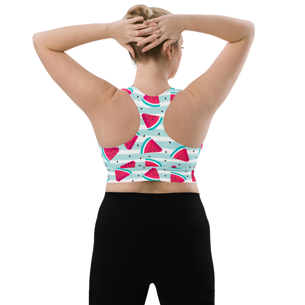 Women’s watermelon stripe buttery soft recycled longline sports bra with pink green slices on blue striped background
