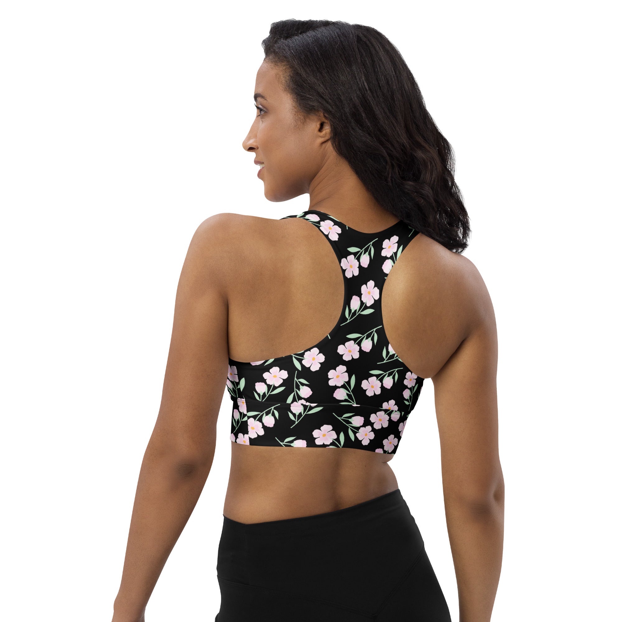 Women’s black longline sports bra with pink floral print thin straps buttery soft recycled fabric high intensity support