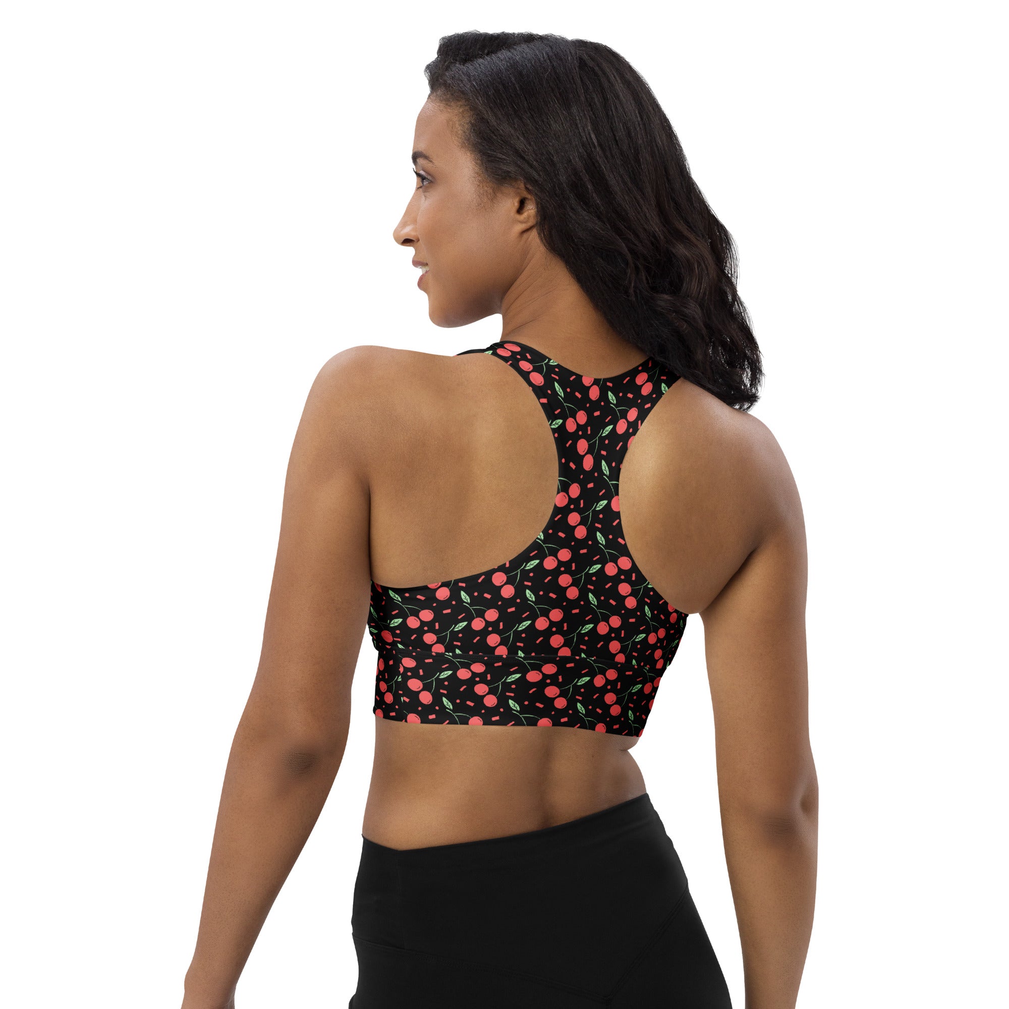 Black sports bra with vibrant pink cherry pattern and green stems made from buttery soft recycled fabric for high intensity support