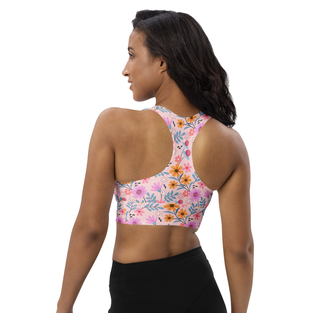 Women’s pink floral print buttery soft recycled fabric sports bra with racerback design for high intensity support