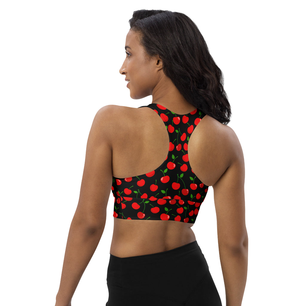 Women’s black recycled longline sports bra with vibrant red cherry print green stems buttery soft fabric