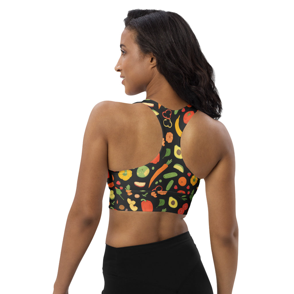 Black women’s longline sports bra with vibrant fruit and vegetable print made from buttery soft recycled fabric