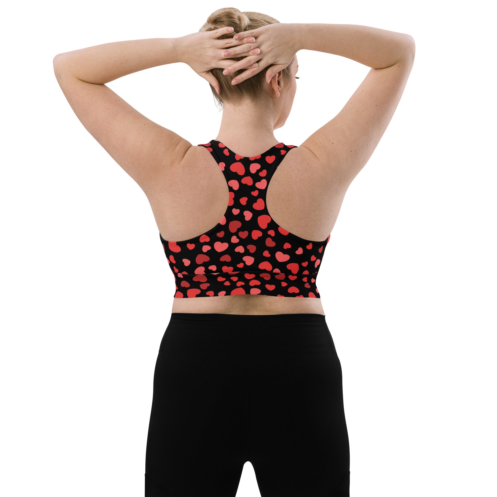 Black womens sports bra with red heart pattern buttery soft recycled fabric high intensity support and quick dry