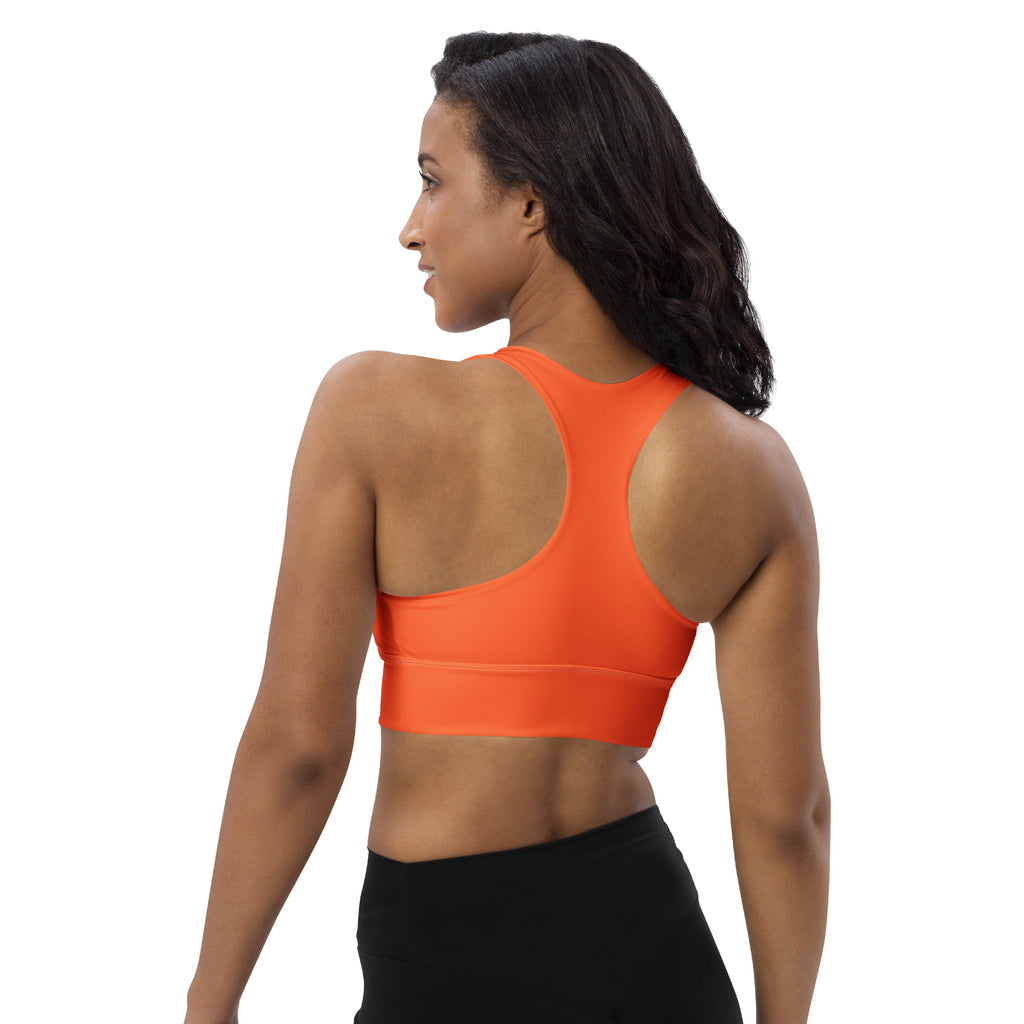Bright orange seamless recycled sports bra with racerback design high intensity support and quick dry fabric