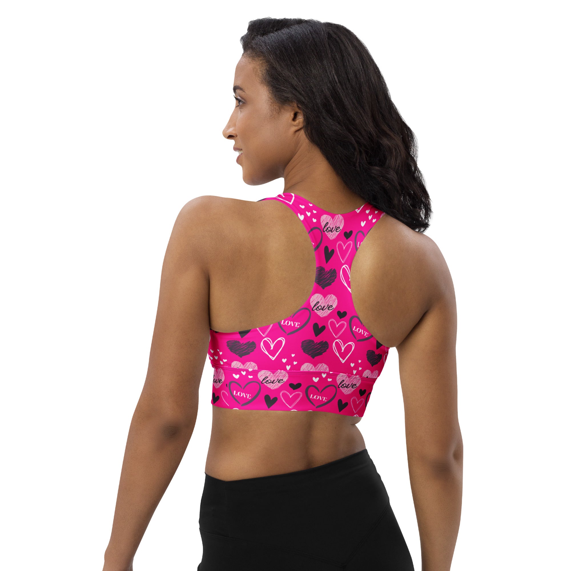 Vibrant pink women’s love heart sports bra with buttery soft recycled fabric high intensity support and quick dry