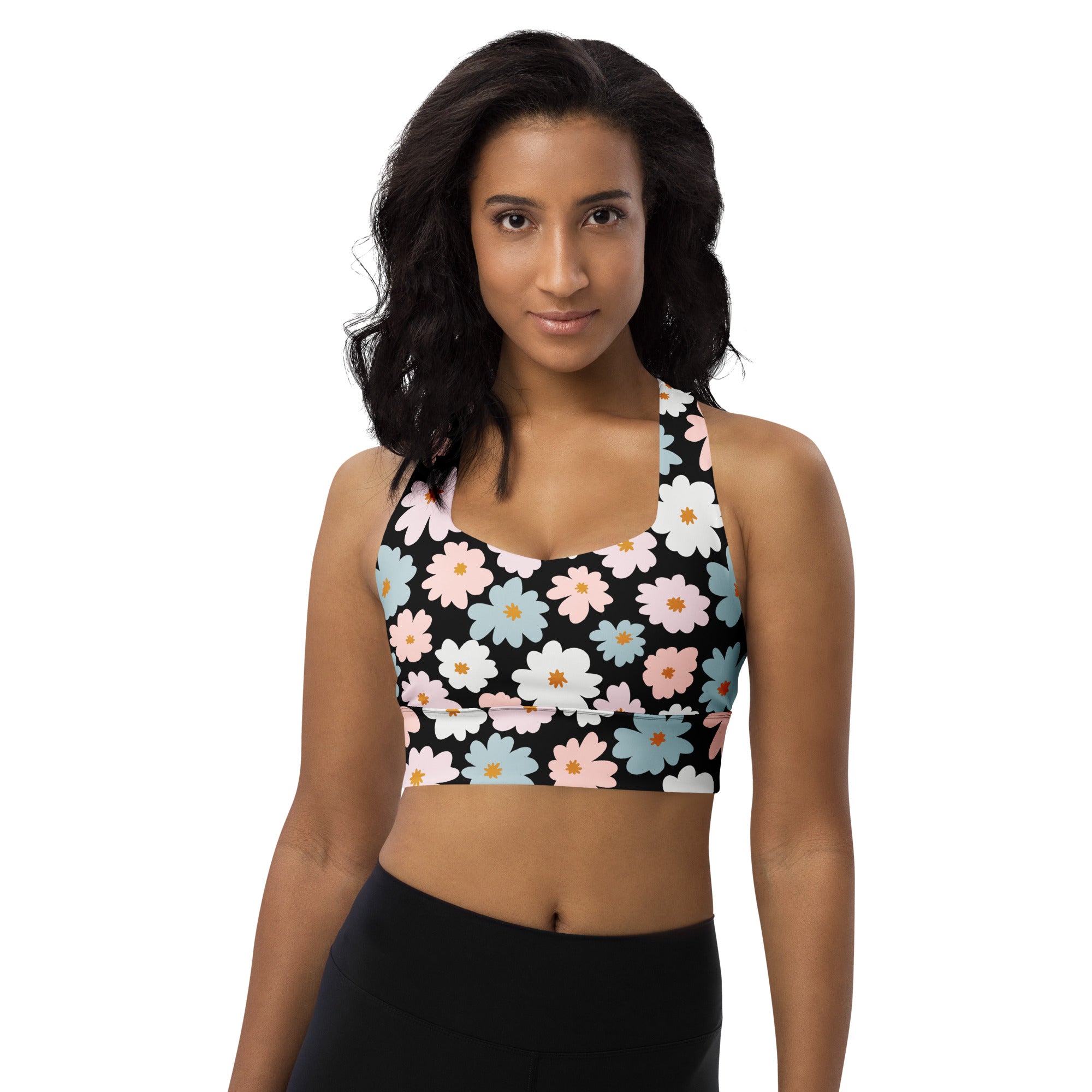 Black longline sports bra with pastel pink white and blue daisies buttery soft recycled fabric high intensity support
