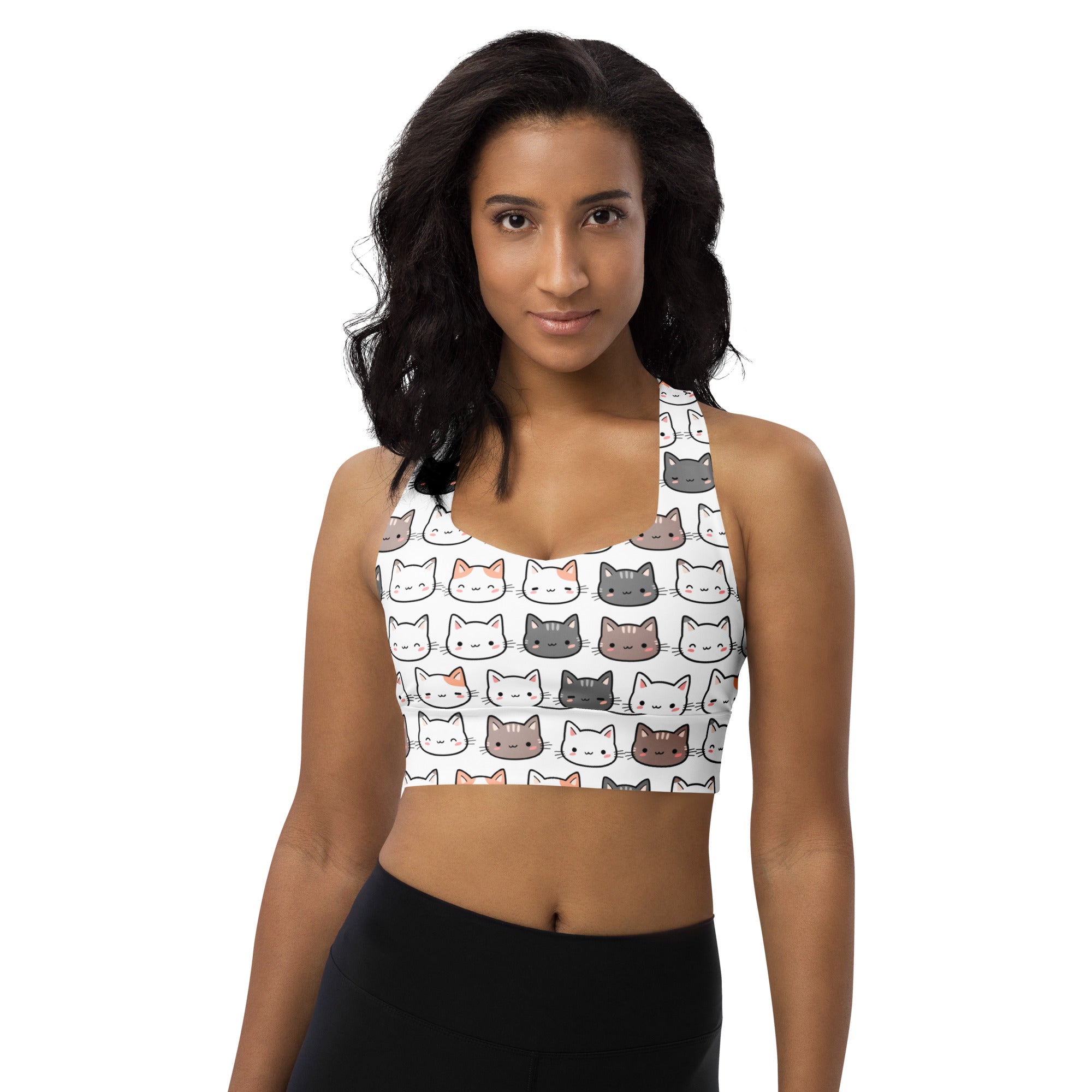White longline sports bra with colorful cartoon cat faces made from buttery soft recycled fabric for high intensity support