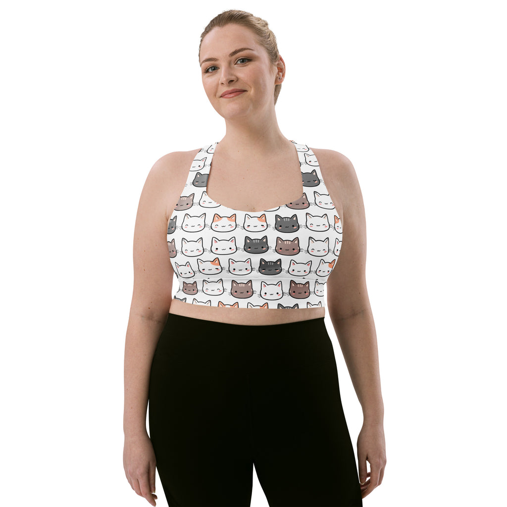 White longline sports bra with colorful cartoon cat faces made of buttery soft recycled fabric for high intensity support