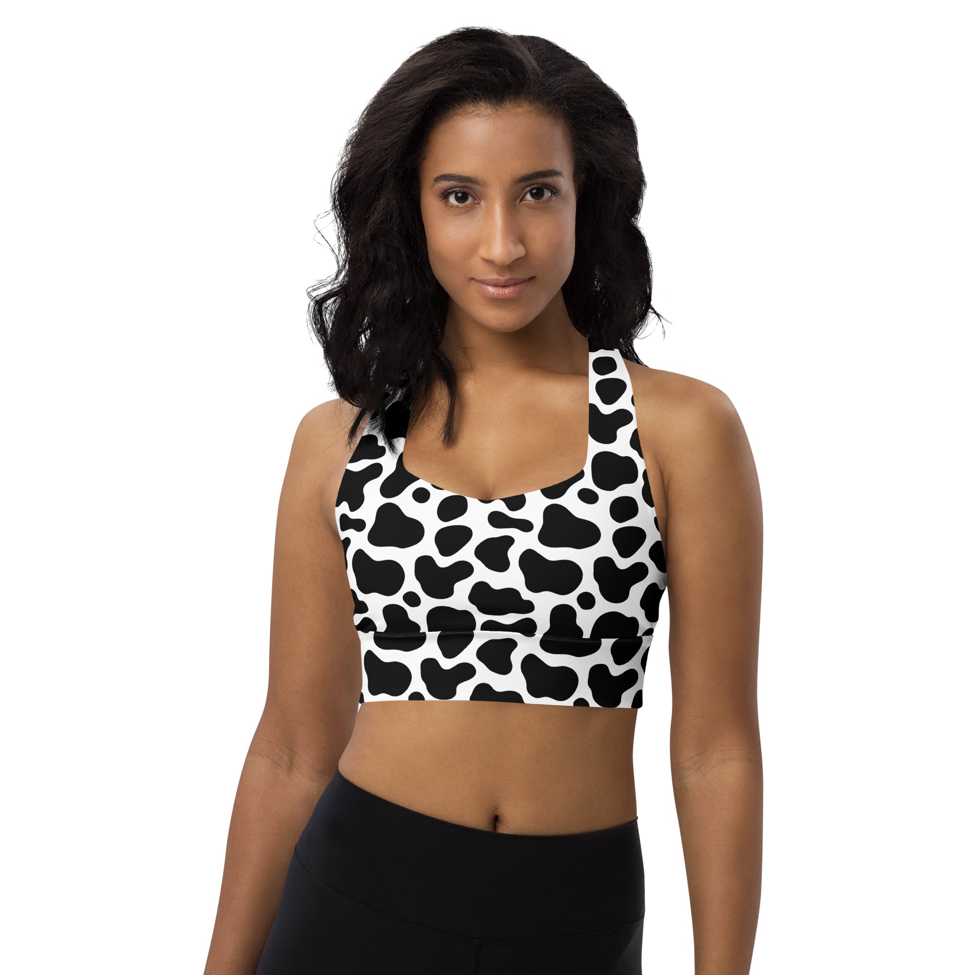 Women’s black and white cow print buttery soft recycled longline sports bra with halter neck and high intensity support
