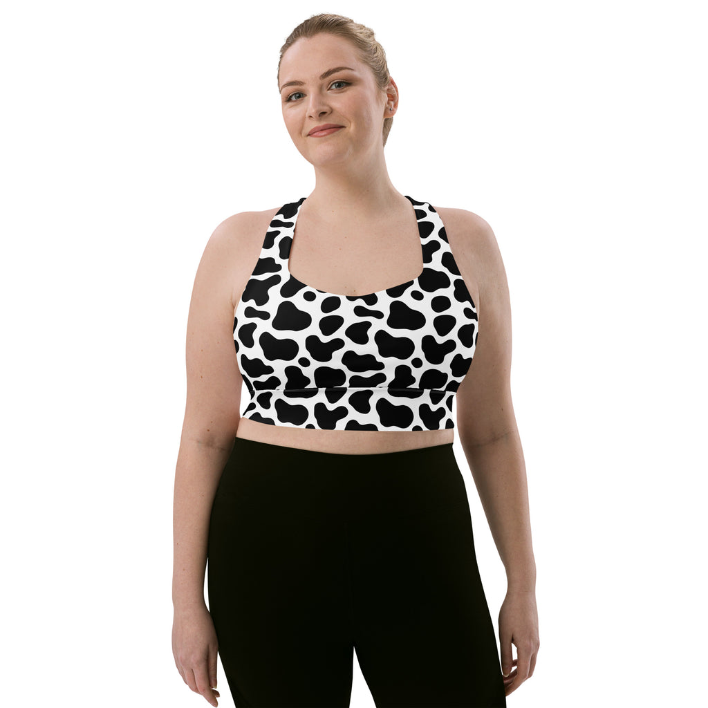 Women’s black and white cow print buttery soft recycled longline sports bra with racerback straps for high intensity support