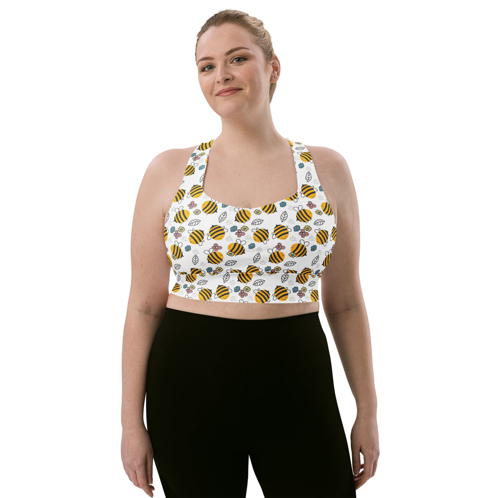 White longline sports bra with yellow and black bumblebee pattern made from buttery soft recycled fabric for high intensity support