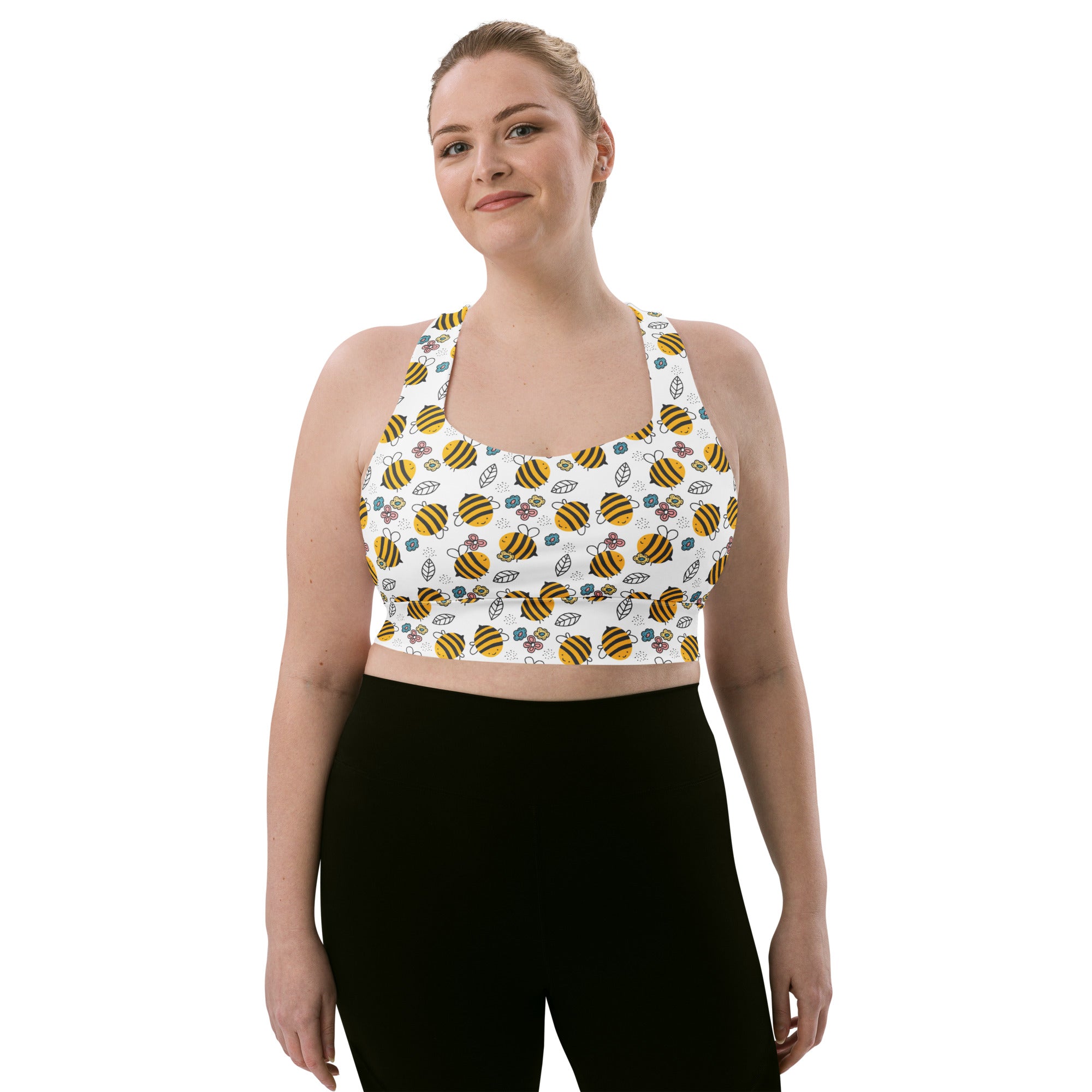 White longline sports bra with yellow and black bumblebee pattern made from buttery soft recycled fabric for high intensity support