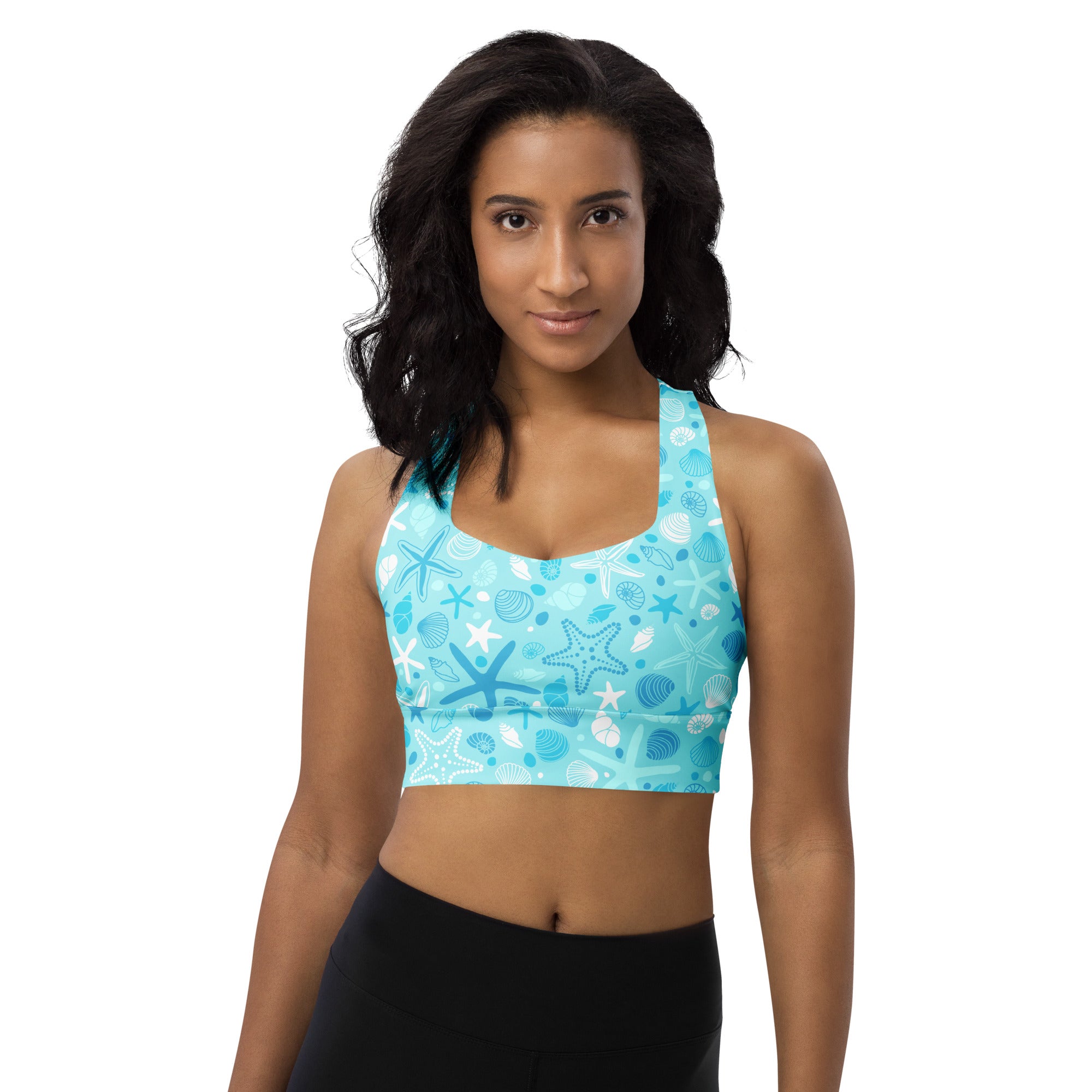 A light blue longline sports bra with starfish and seashell patterns offering high intensity support and quick dry
