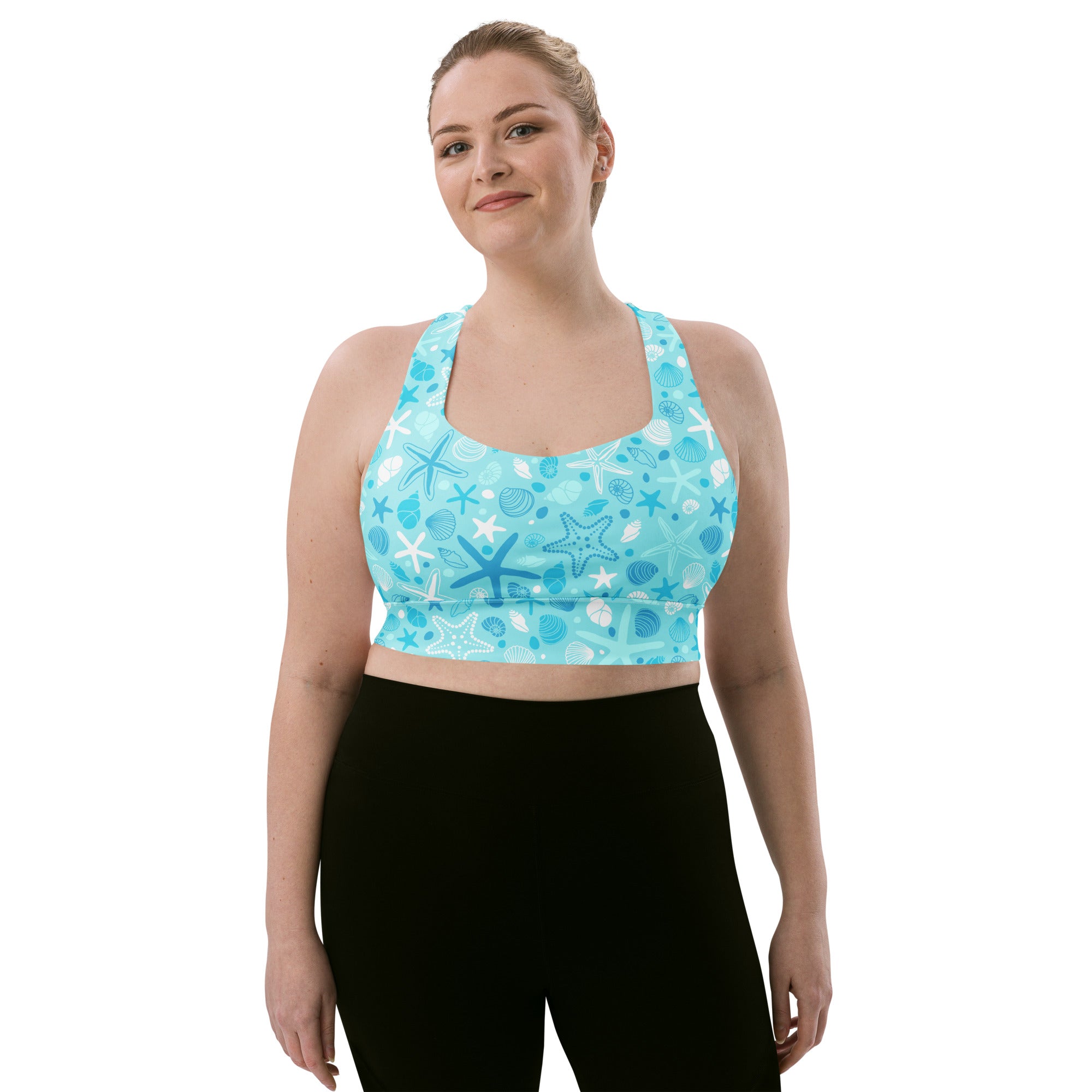 Women’s light blue longline sports bra with starfish and shells print made from buttery soft recycled fabric for high support