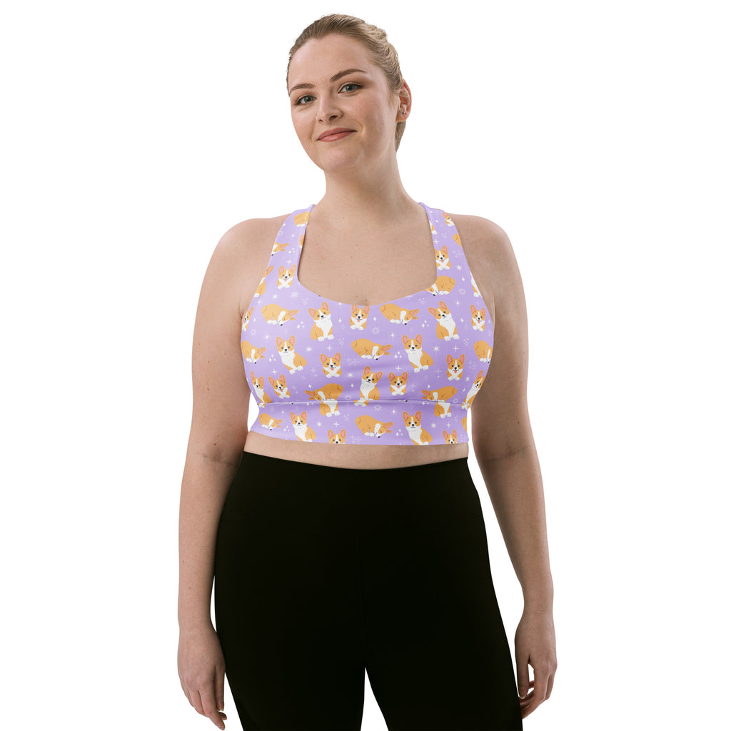 Women’s purple longline sports bra with high intensity support featuring a playful orange and white corgi pattern