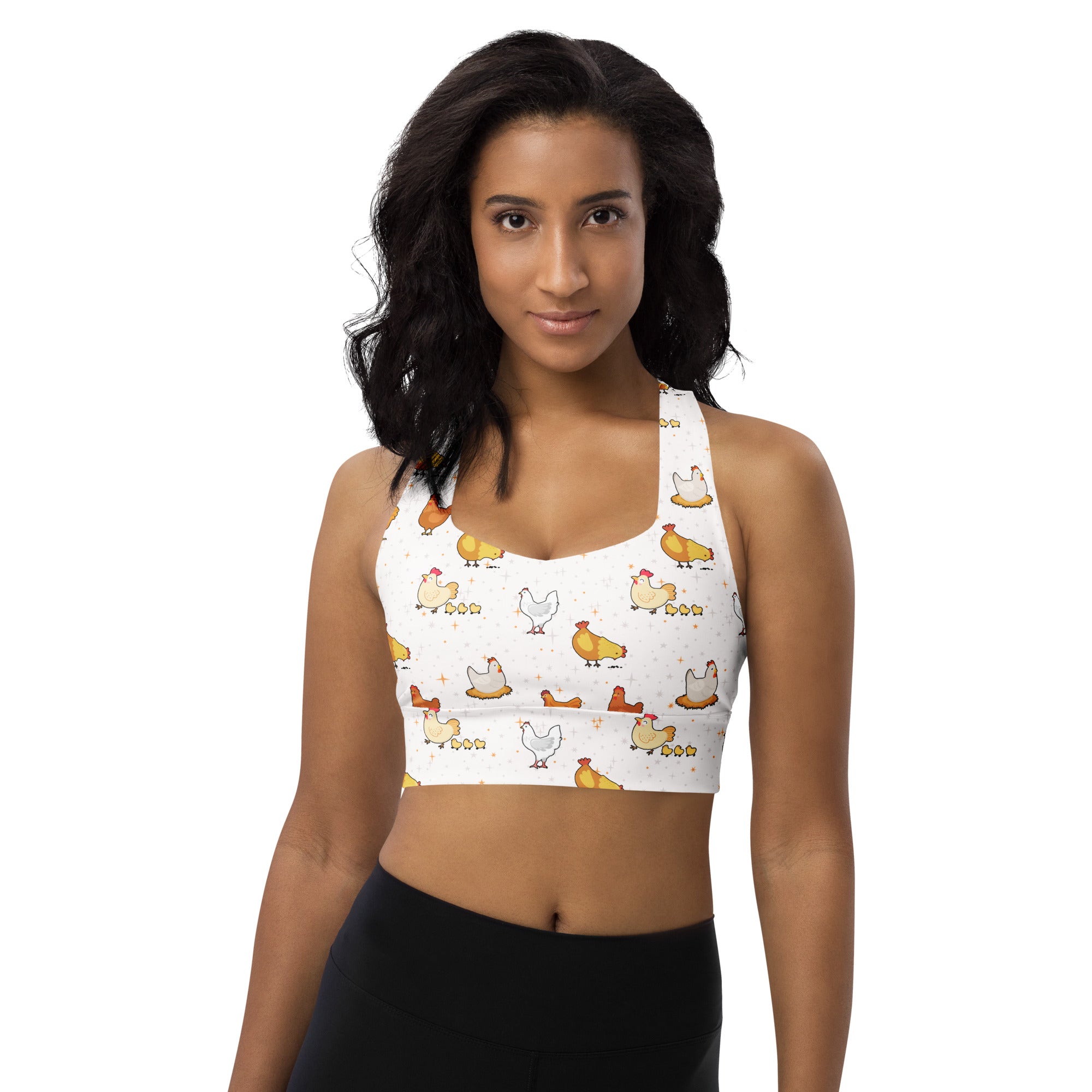 White womens longline sports bra with playful yellow orange chicken pattern buttery soft recycled fabric high support