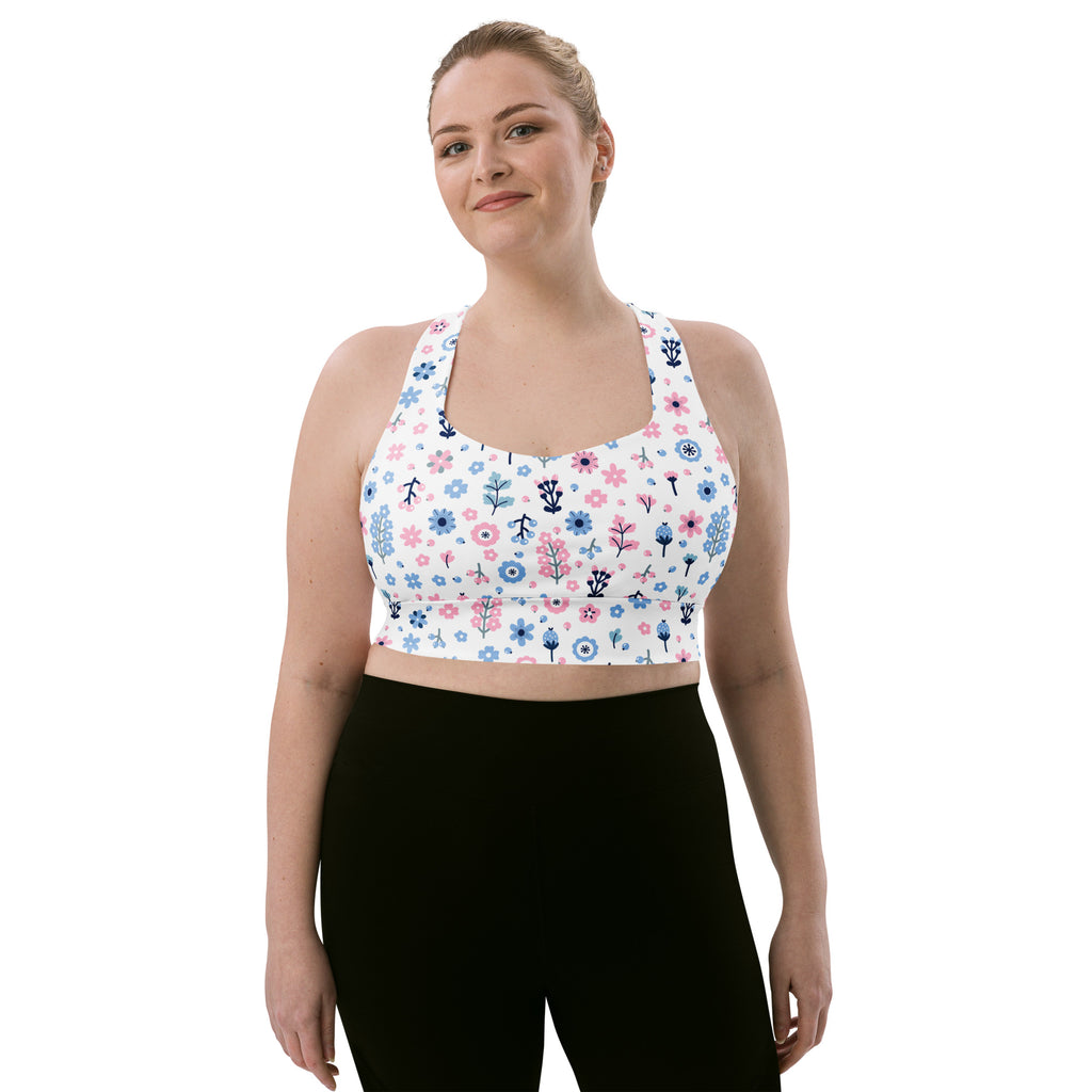 White recycled longline sports bra with pink and blue floral print high intensity support quick dry upf 50+