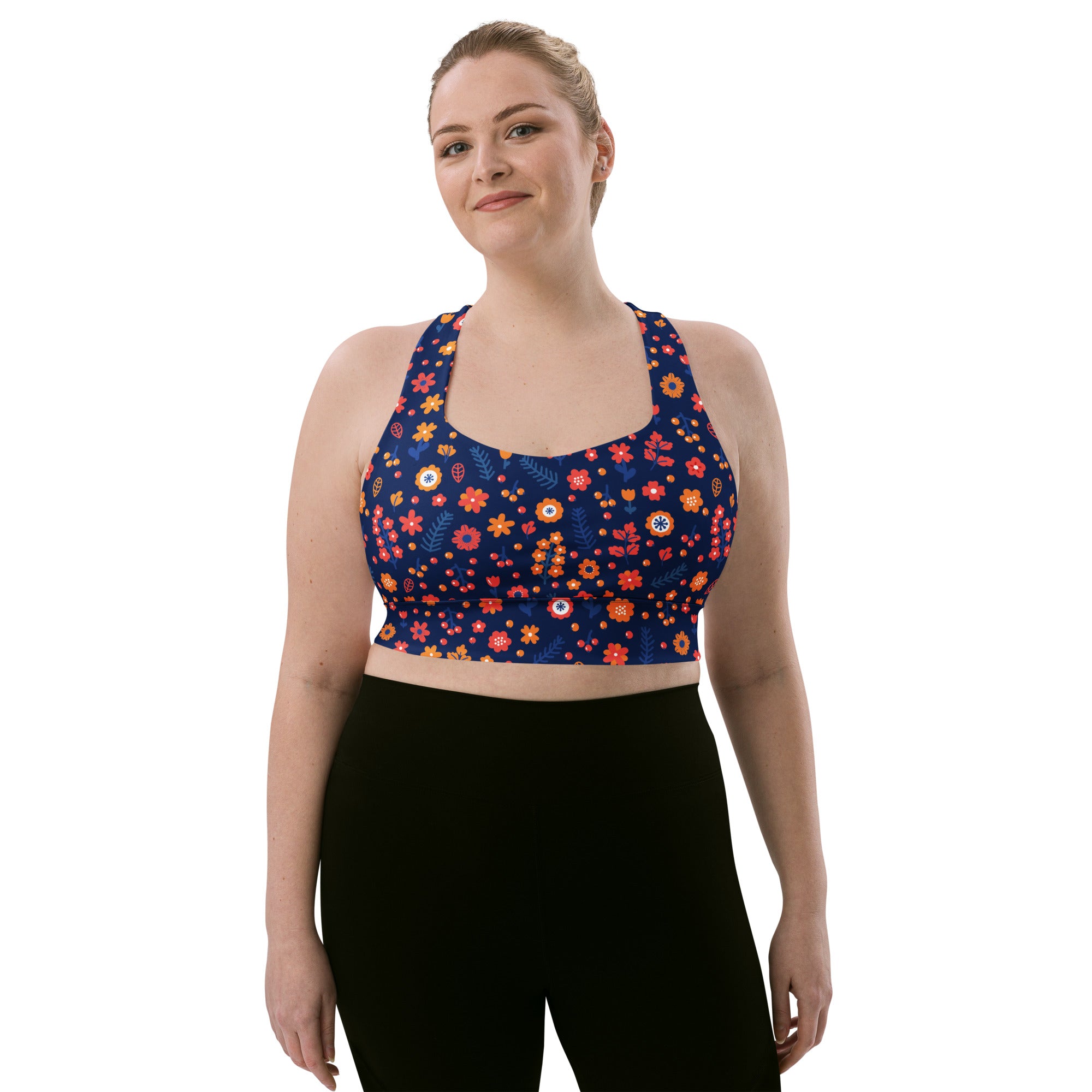 Women’s navy blue longline sports bra with vibrant floral pattern made from buttery soft recycled fabric for high intensity support