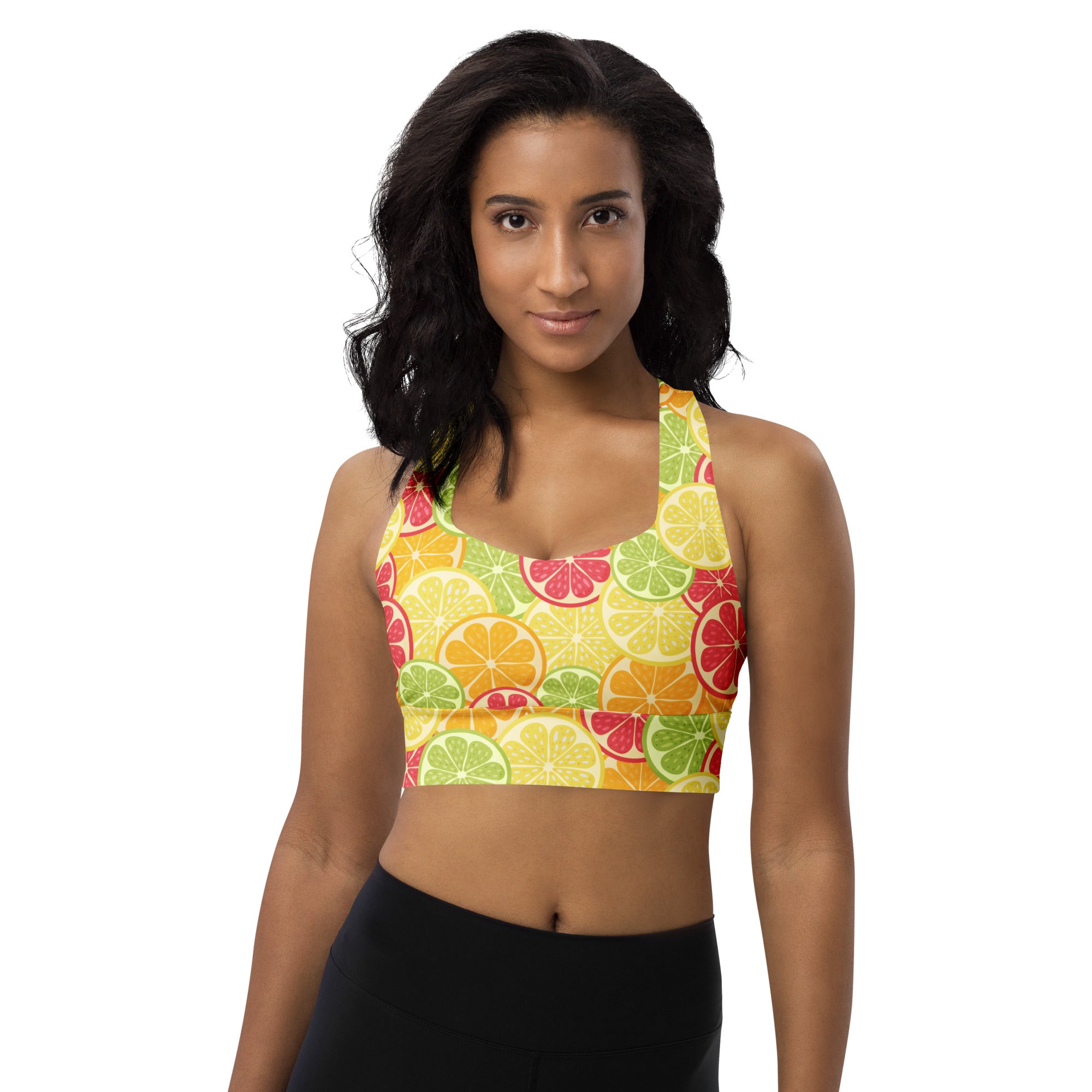 A vibrant yellow women’s citrus slice buttery soft recycled longline sports bra with high intensity support and citrus pattern